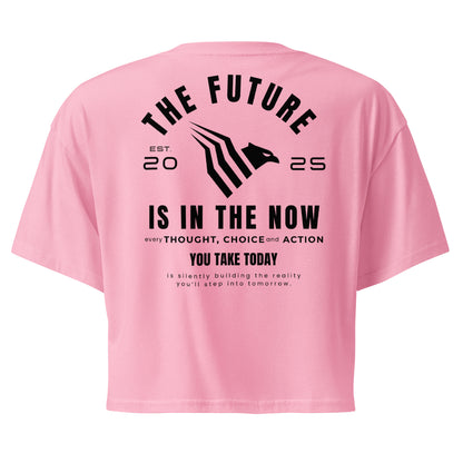 Pink crop top with motivational text on the back on a white background. Minimalist motivational crop top designed for confident women with purpose.