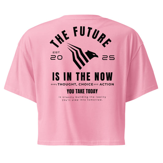 Pink crop top with motivational text on the back on a white background. Minimalist motivational crop top designed for confident women with purpose.