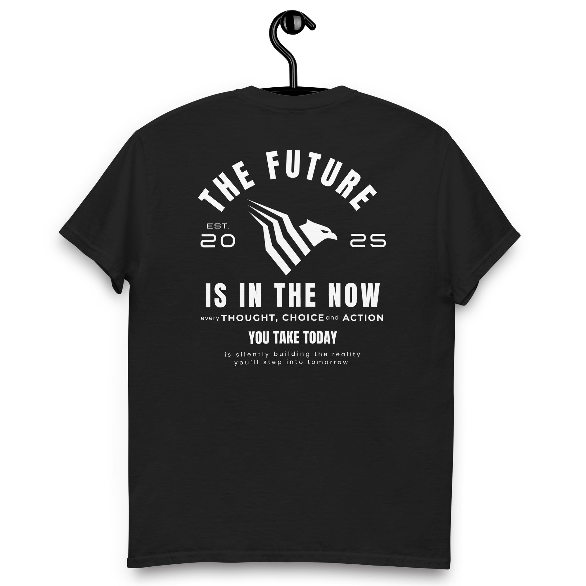 Black t-shirt with motivational quote on a hanger against a white background. Streetwear-inspired t-shirt combining simplicity and confidence.