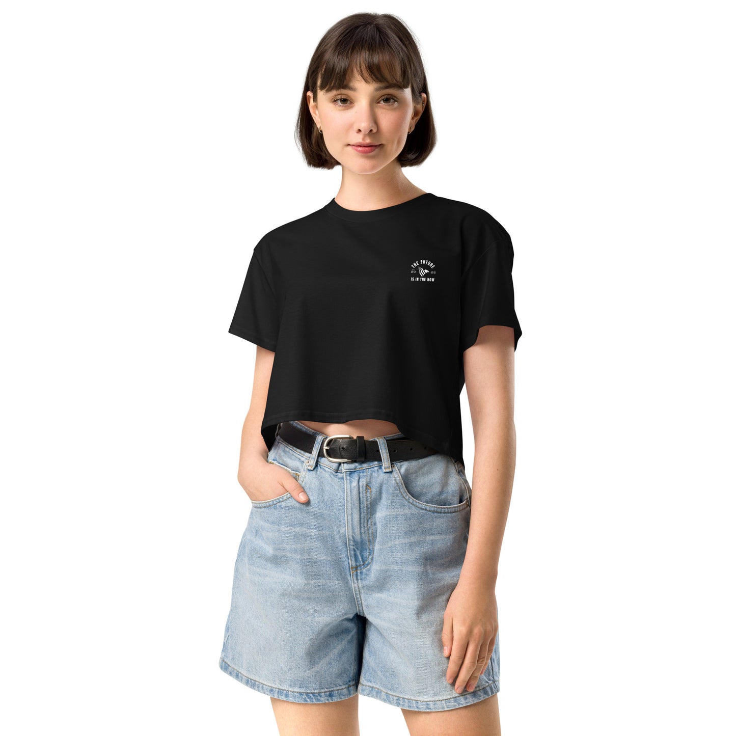 Person wearing a black t-shirt with a logo and light blue denim shorts on a white background. Ambition-inspired crop top for women who chase goals in style.