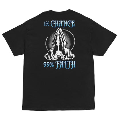 Black t-shirt with praying hands graphic and text '1% Chance' and '99% Faith' on a white background. High-quality mindset t-shirt for creators and achievers.